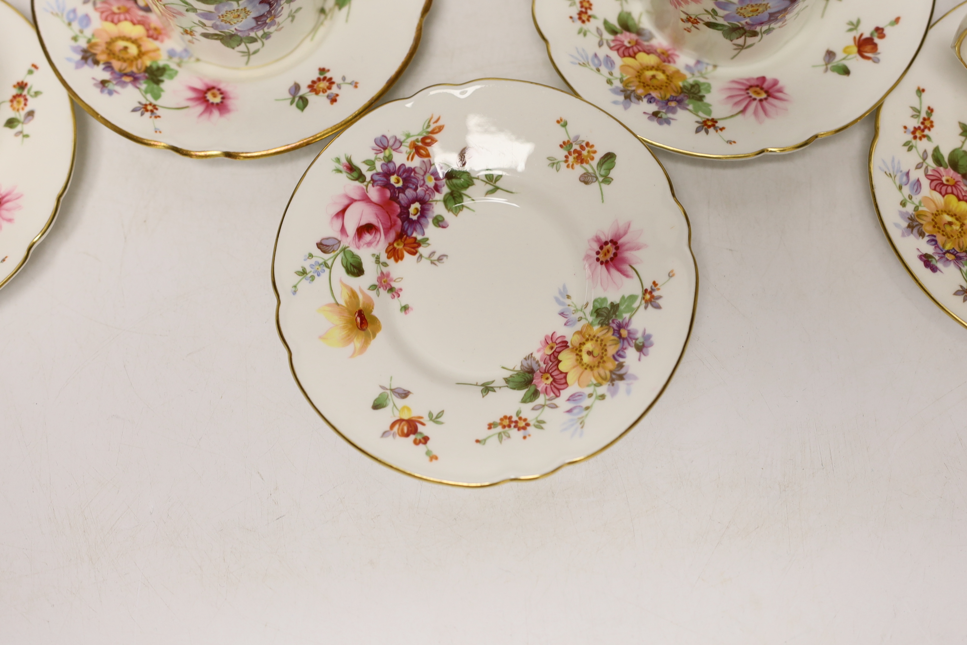 A Royal Crown Derby Posies coffee set comprising of seven cups and saucers, a sugar bowl and milk jug